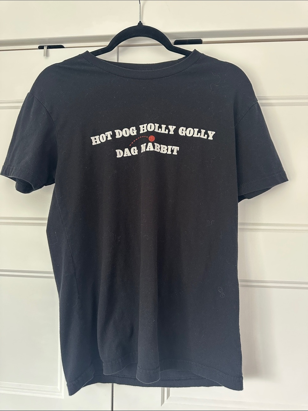 Black Graphic Tee with 'Hot Dog Holly Golly' Text